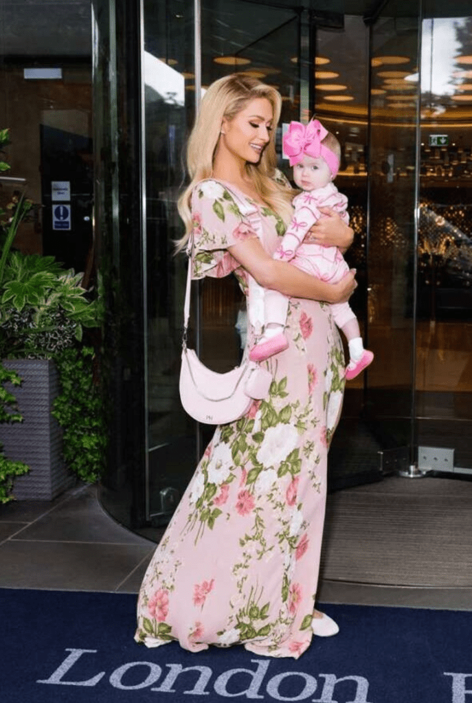 Paris Hilton holding her baby.